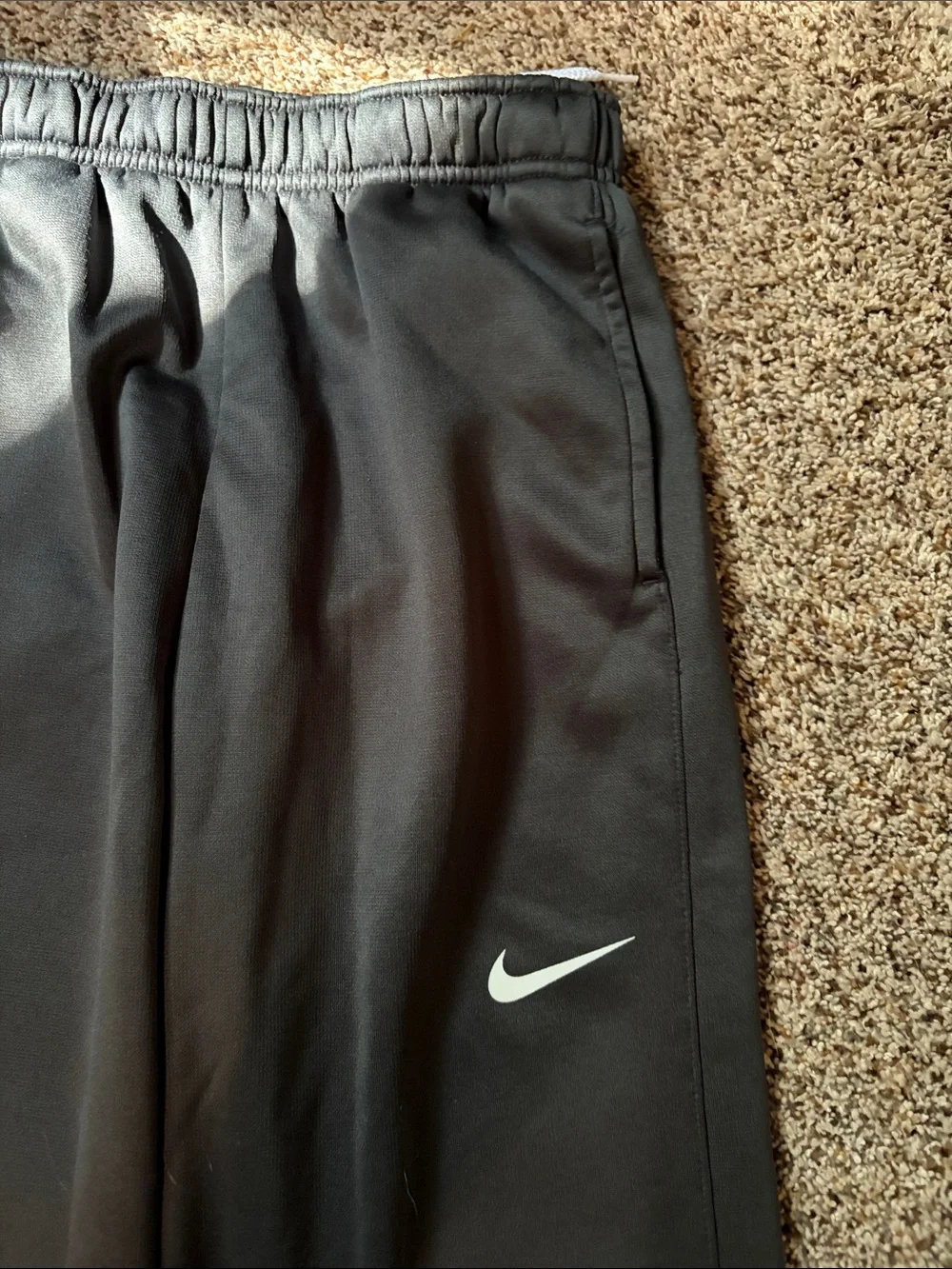 Nike dark gray Sweatpants with White Swoosh